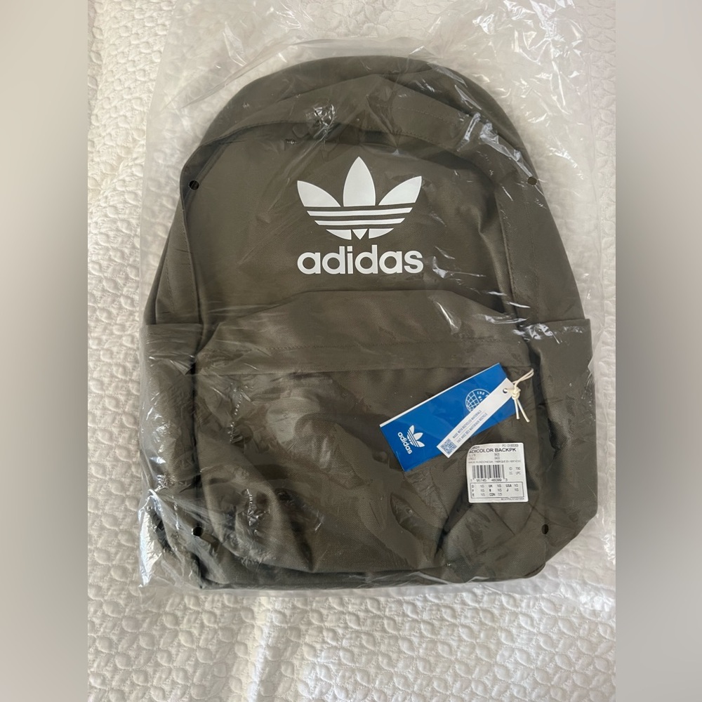 Adidas canvas backpack. 100% polyester. Brand new with tags.Gry/grn moss color